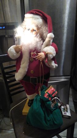 2 1/5 feet high.musical santa claus figure moving Head and hands comes with extra light bulbs
