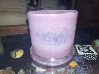 Purple glass candle holders / jars (several frosted or solid purple pieces, including one larger swirled jar):