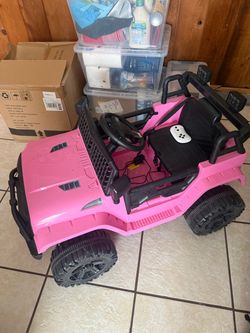 Pink power wheel jeep