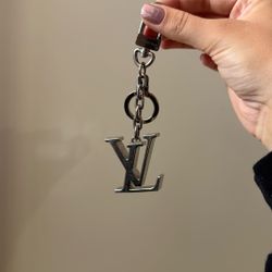 BARELY USED, AUTHENTIC: Louis Vuitton Initials Key Holder and Bag Charm 