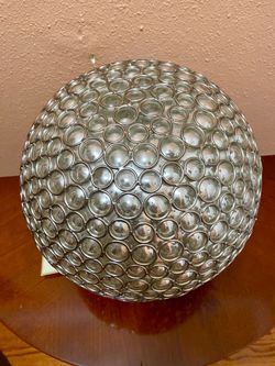 Beautiful Domain decorative orb with a unique silver metallic finish and intricate circular design. It has the elegant look of mercury glass but is ma