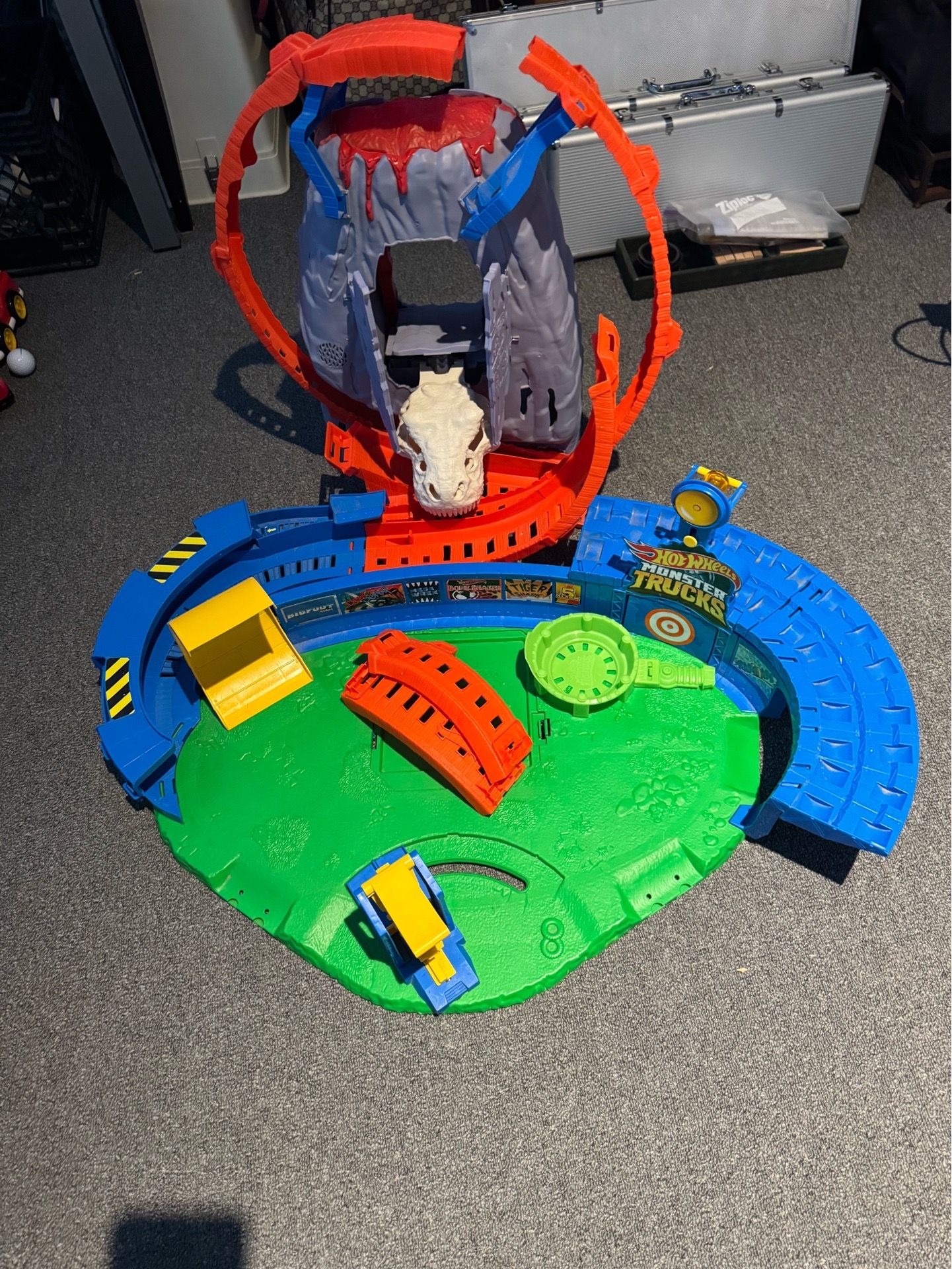 Hot Wheels Monster Trucks T-Rex Volcano Arena playset.