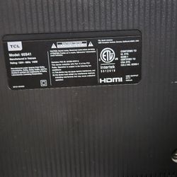 65" TCL Roku TV and glass TV Stand