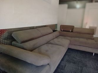 Free Delivery Today! Just cleaned ! Beautiful sectional sofa couch . No rips or stains. Storage and adjustable headrest