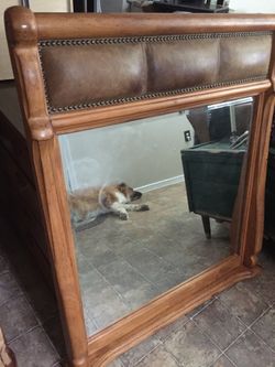 Heavy wood mirror with padded leather