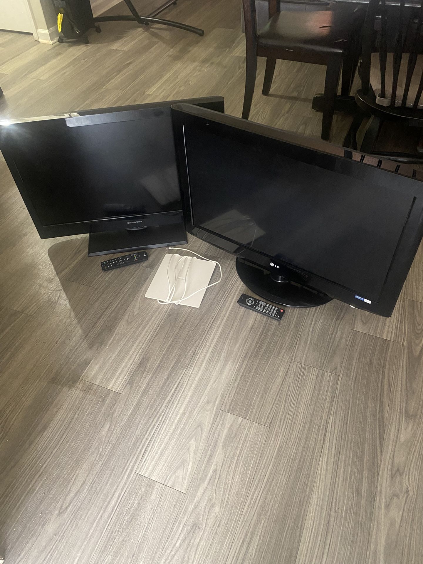 Two Flat TVs with remotes.