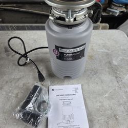 New Glacier Bay TurboGrind 1/2 hp. Continuous Feed Garbage Disposal with Power Cord. Cracked cover!