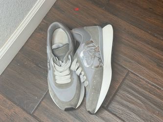 Alexander McQueen Sprint Runner sneakers in a grey and silver colorway