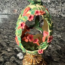 Faberge egg with hummingbird inside