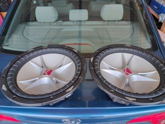 Pair of Kicker Subwoofers and Planet audio Amp