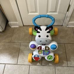 FISHER PRICE WALKER WITH LIGHTS, MUSIC AND ACTIVITIES 
