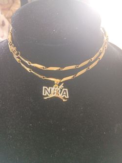 NRA gold-plated medallion with cubic zirconium on a gold tone beaded necklace of stainless steel necklace with lobster clamps 25 in Long