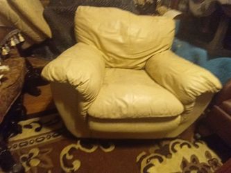 Ivory leather chair with ottoman 50. Brown side chairs 30. Ea.