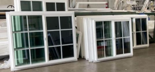White Vinyl Sliding Windows with Grids