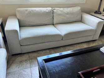 Two light grey couches