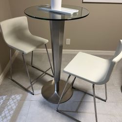 metal pub table and 2 bar stools