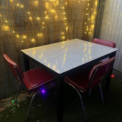 Black Wood Table With 3 Red Chairs