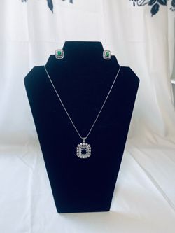 silver-toned, rectangular emerald and American diamond studded jewelry set