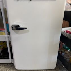 Fully functioning Frigidaire brand fridge with mini freezer.