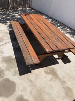 Professionally built outdoor wooden table 10 years old / weathered 84x 61 x 29