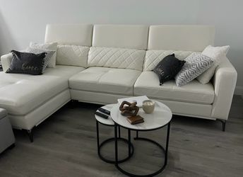 White leather sectional and tables