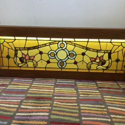 VINTAGE 12 JEWEL STAINED GLASS TRANSOM WINDOW SET IN WOODEN FRAME WITH LIGHTS -50” X 18” 