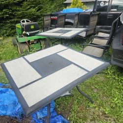 2 outdoor tables and 8 outdoor chairs