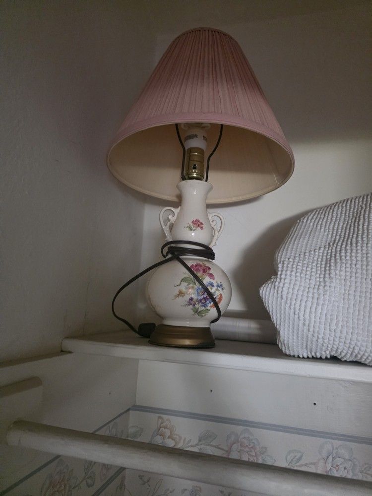 Floral decorated porcelain and brass lamp with shade;