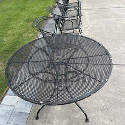 42” Wrought Iron table with 4 matching chairs $199.