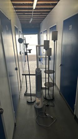 Fan, shelving, desk, and lamps
