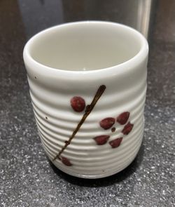 Vintage Japan Handleless Pottery Tea Cup With Flower (1980’s). Signed