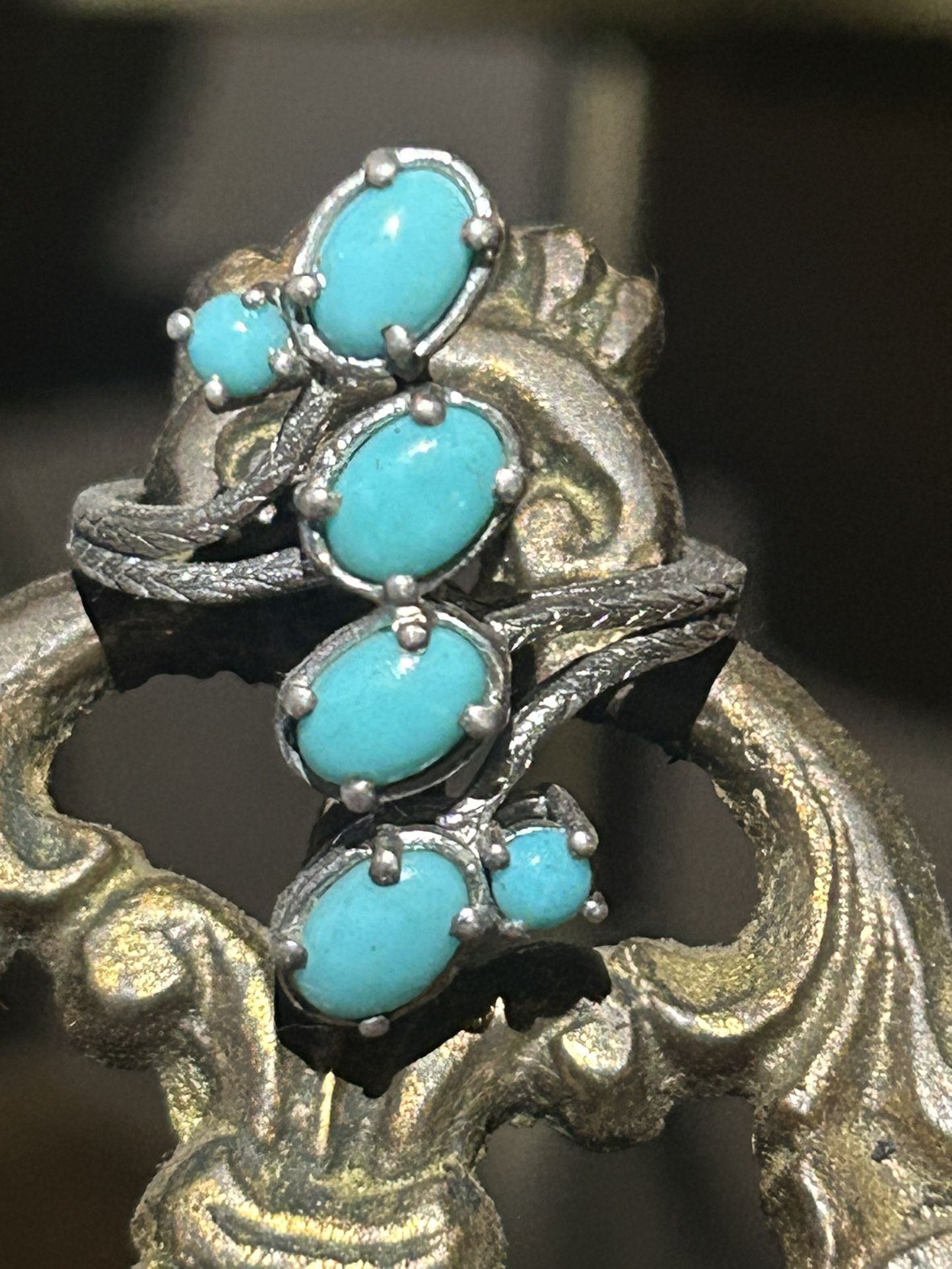 A Navajo sterling silver with six individual sleeping beauty stones turquoise