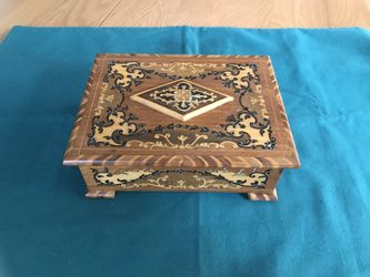Vintage Swiss music box with inlaid wood