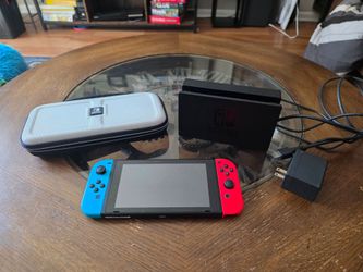 Nintendo Switch with dock, charger, and HDMI cord.