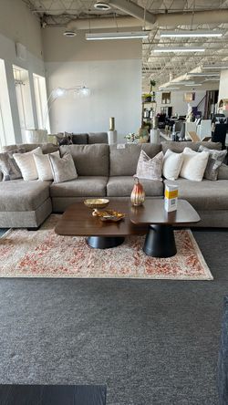 Beige sleeper sectional double chase with a full size pull out mattress