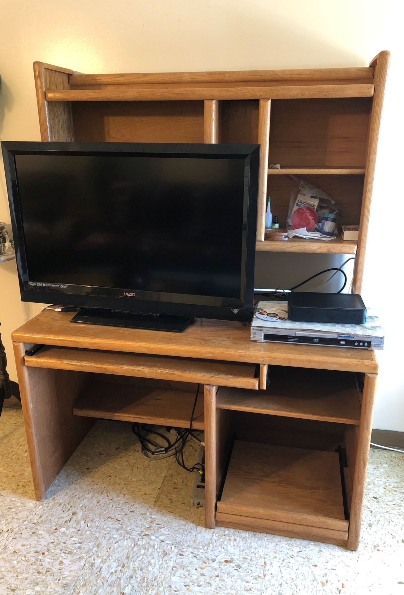 Solid wood desk used as entertainment center