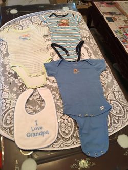 Baby clothing, baby wipes, small thermos and baby’s boom big baggies