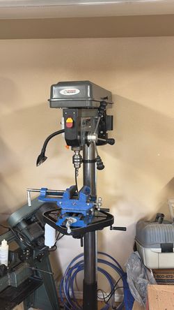Drill press with slider