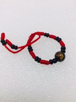 Baby bracelet “Tiger Eye “ stone . Adjustable, red String for Protection and prosperity