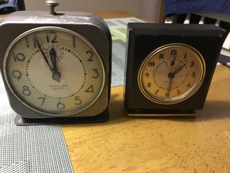 Antique wind up clocks and one electric.