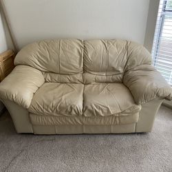 Tan leather love Seat