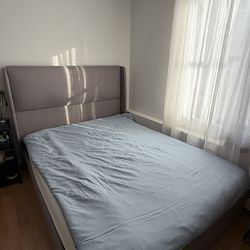 Queen Size Bed In Grey Color And A Mattress