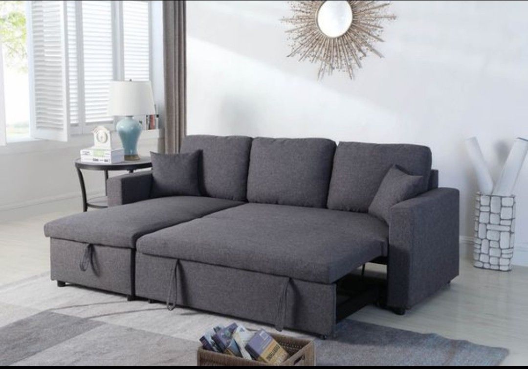 Grey sectional sofa pull out bed & storage chaise