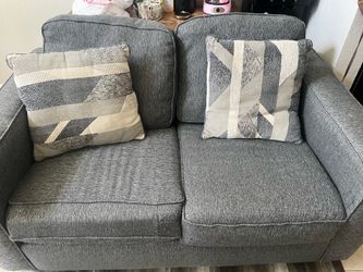 Two seater gray sofa