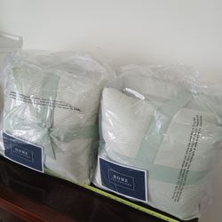 two packaged sets of "Home Reflections" brand Pillows 