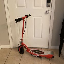 Razor E100 Electric Scooter for Kids Ages 8+ - 8" Pneumatic Front Tire, Hand-Operated Front Brake, Up to 10 Mph and 40 Min of Ride Time, for Riders Up