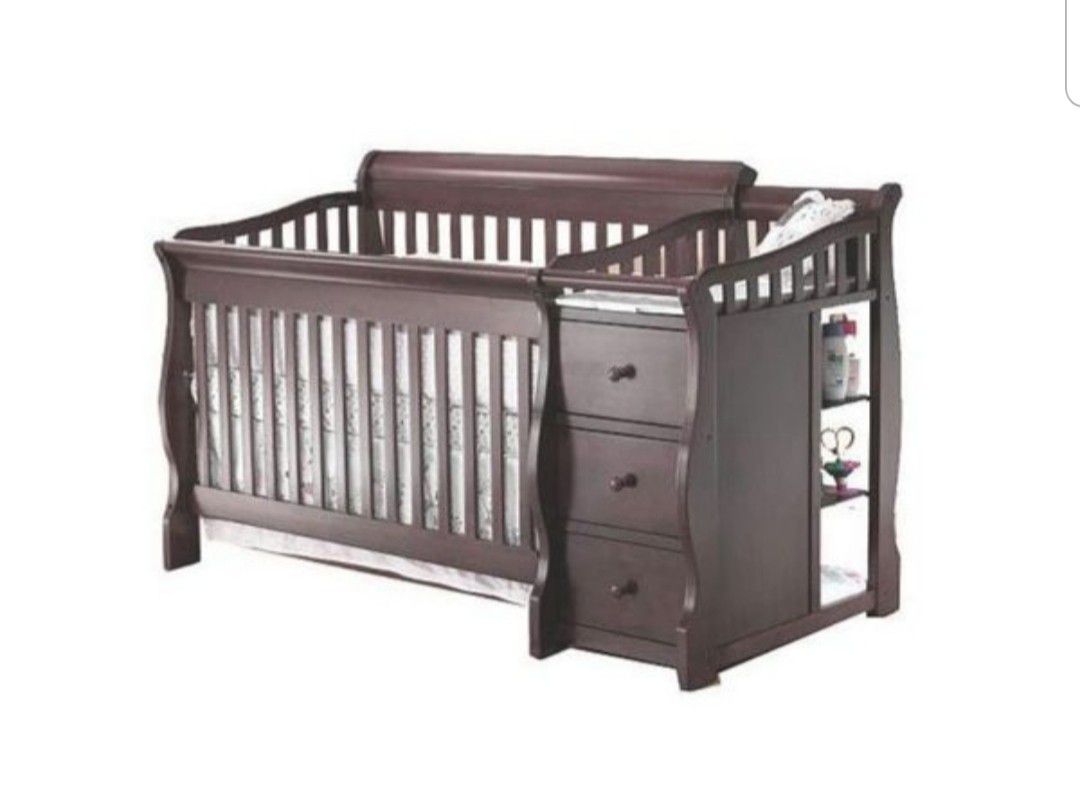 Crib with attached dresser and changing table