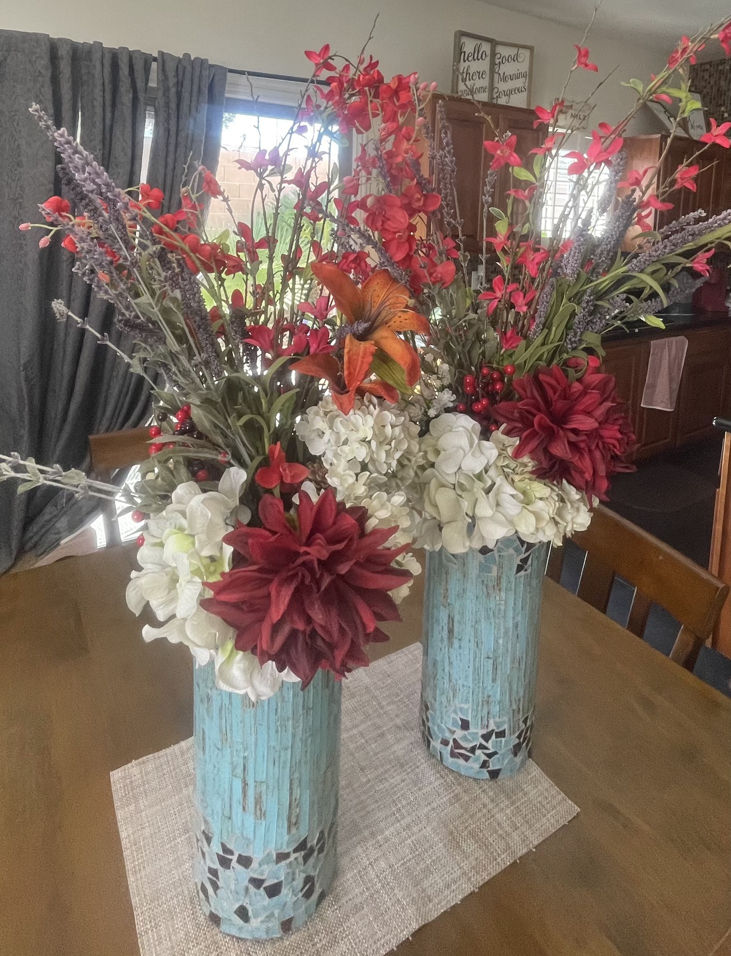 Two glass mosaic blue vases with faux flowers included. 