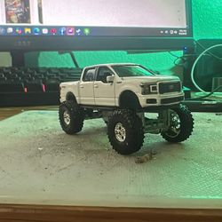 Custom green light squatted Ford Truck
