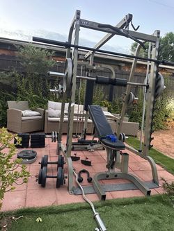 BODY SOLID OLYMPIC SQUAT RACK SMITH MACHINE WITH OLYMPIC WEIGHTS AND BENCH